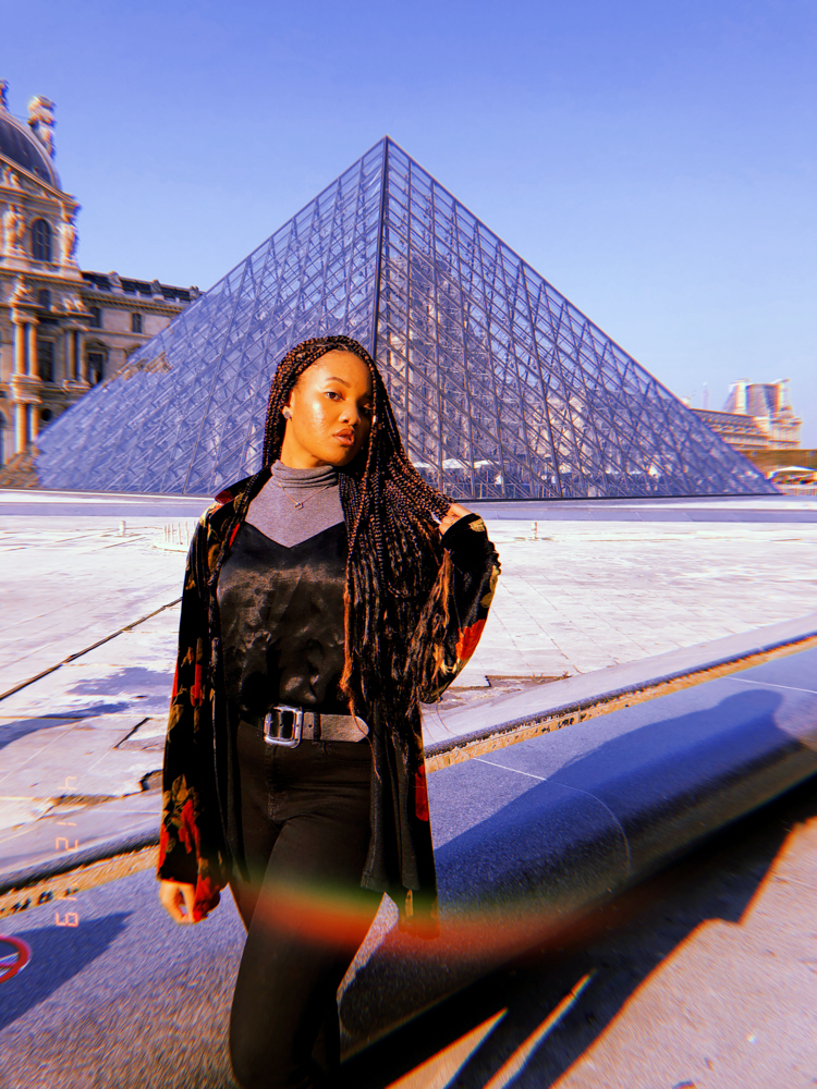 black girl outside the Louvre Paris France