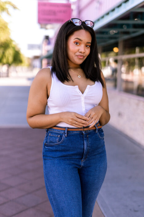 black girl in front of retro Las Vegas store