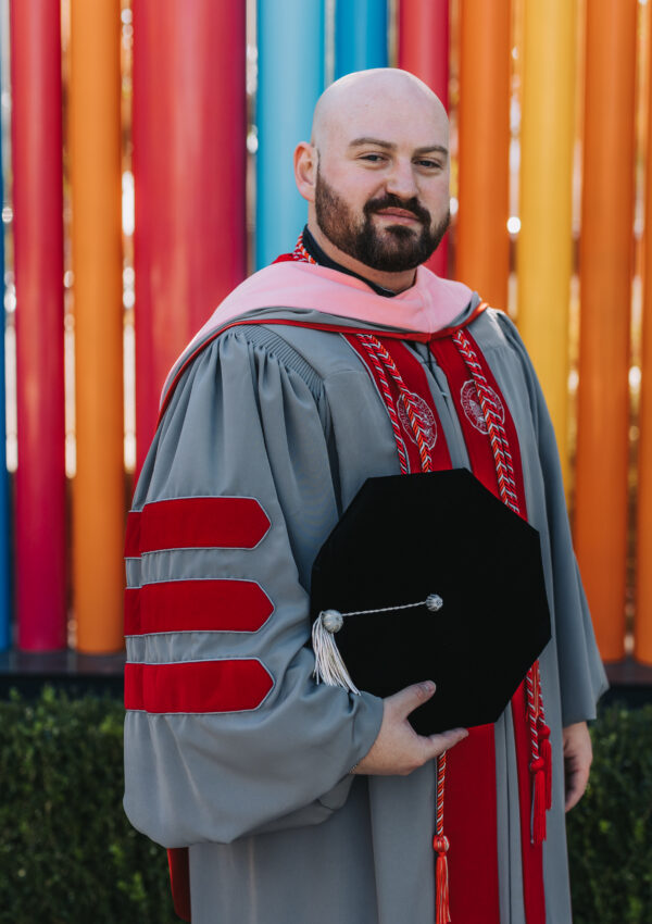 UNLV phd graduation red and grey cap and gown